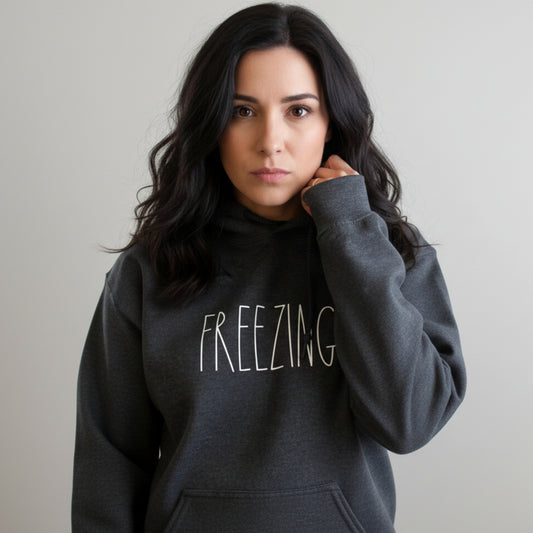 Dark heather grey Freezing hoodie for women — relatable winter gift for her, perfect for the friend who wears a hoodie in July and has zero regrets