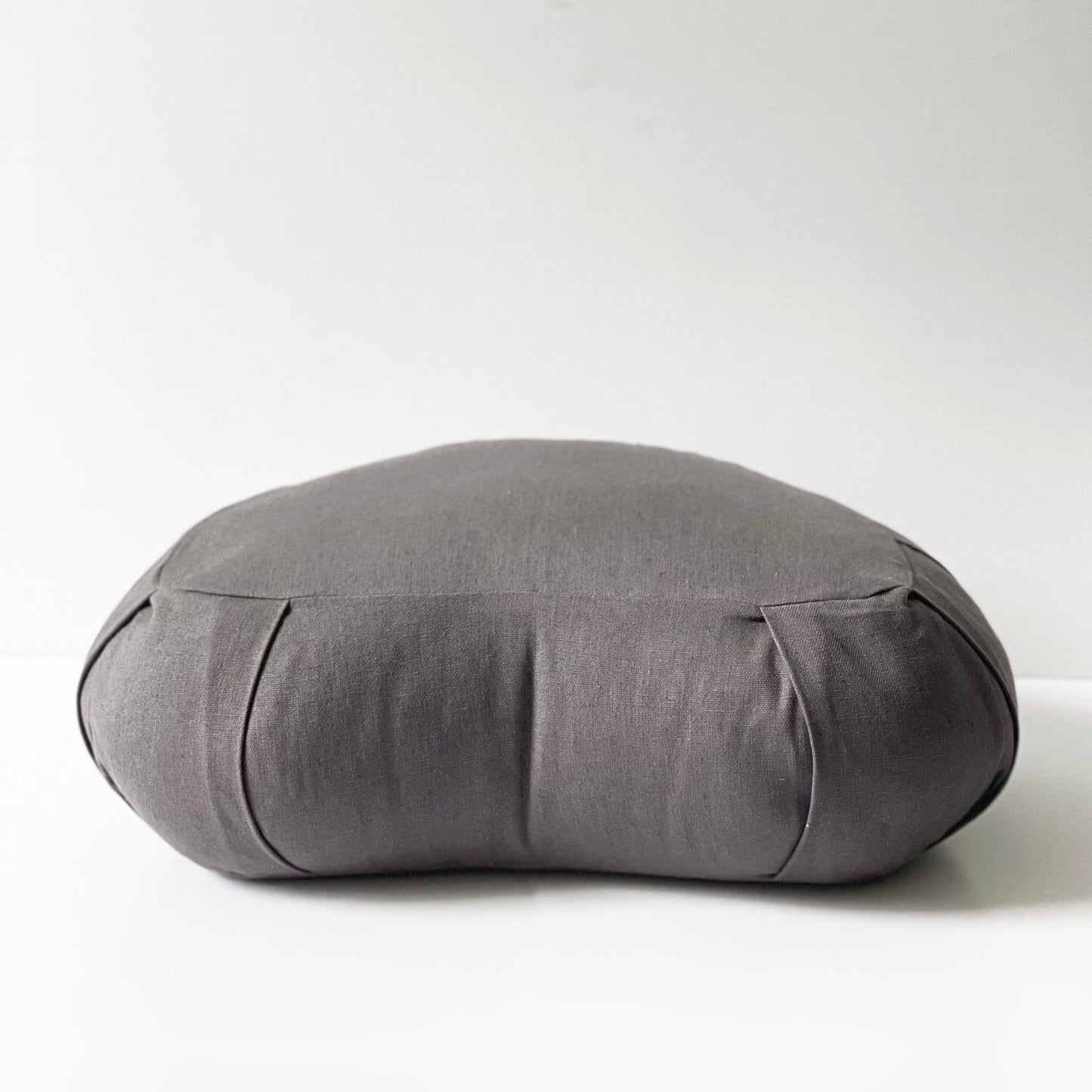 Gray meditation pillow on a white background