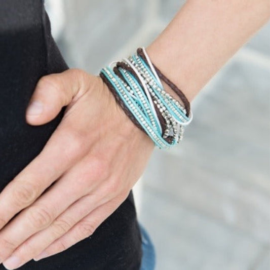 Turquoise and brown beaded wrap bracelet worn on wrist — ethically sourced boho jewelry handmade in India