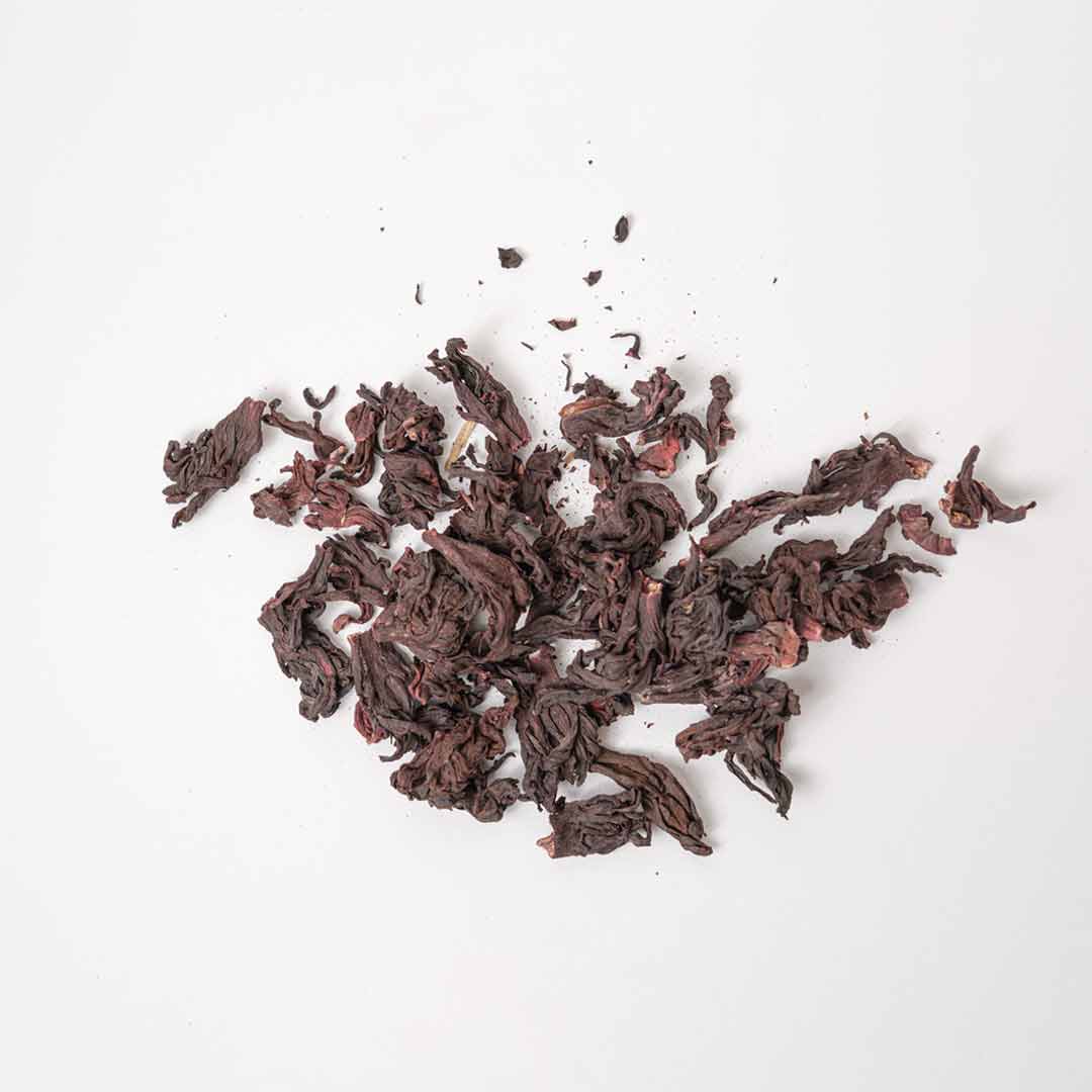 Close-up of whole dried hibiscus flowers — ruby red loose leaf tea by Rayhana Organics