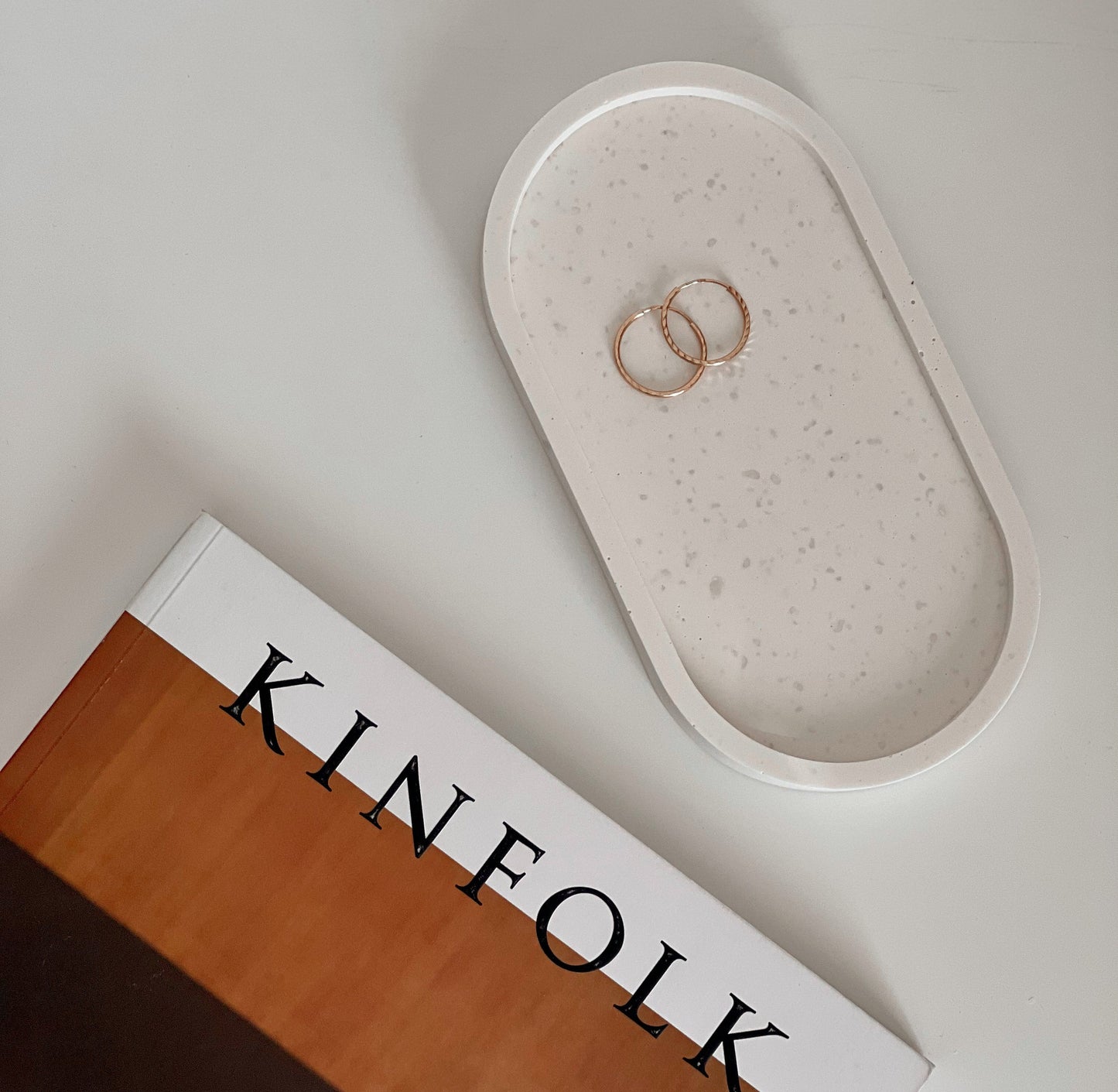 Jesmonite oval trinket tray styled with jewelry