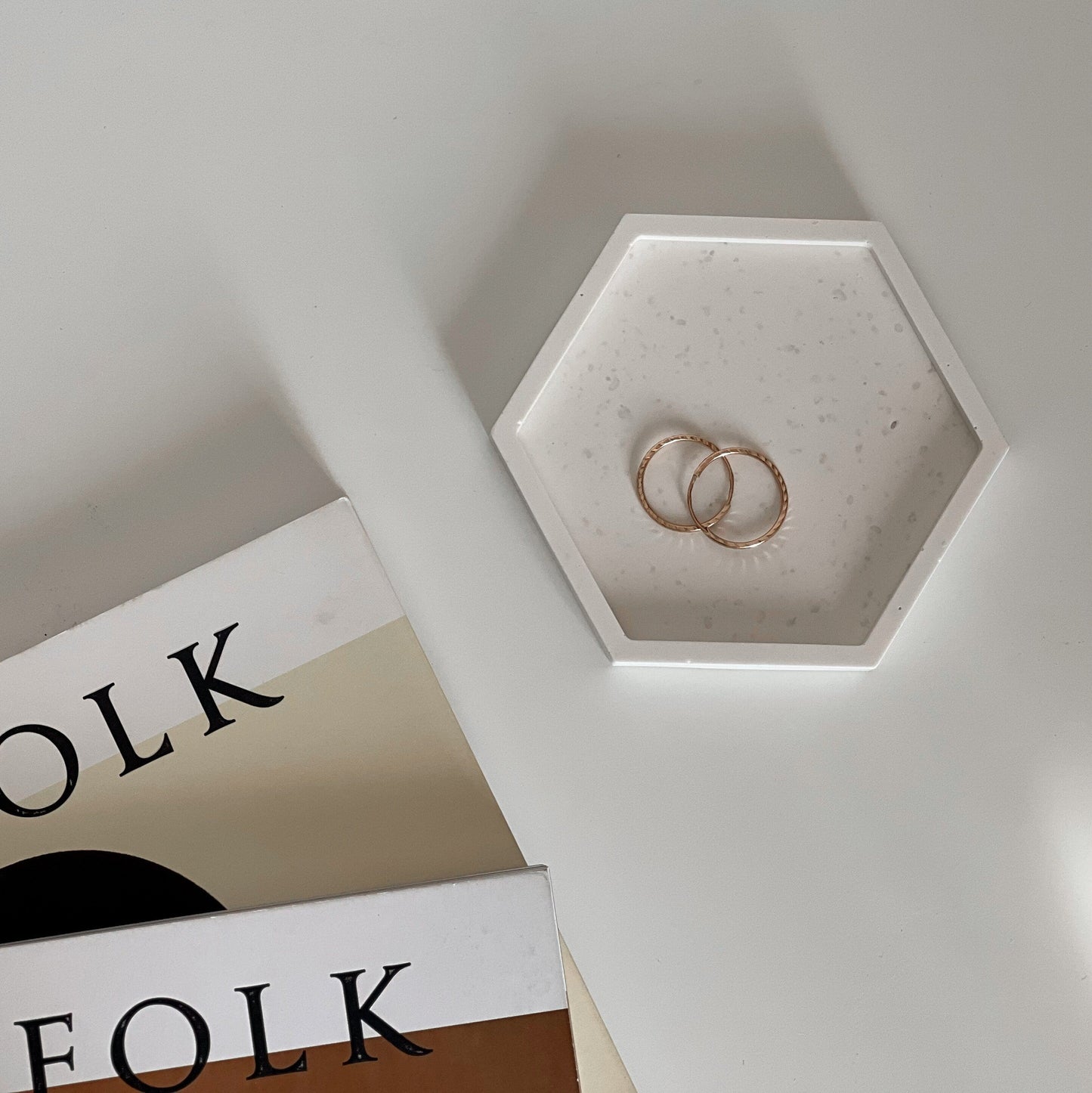 Jesmonite hexagon trinket tray styled with jewelry