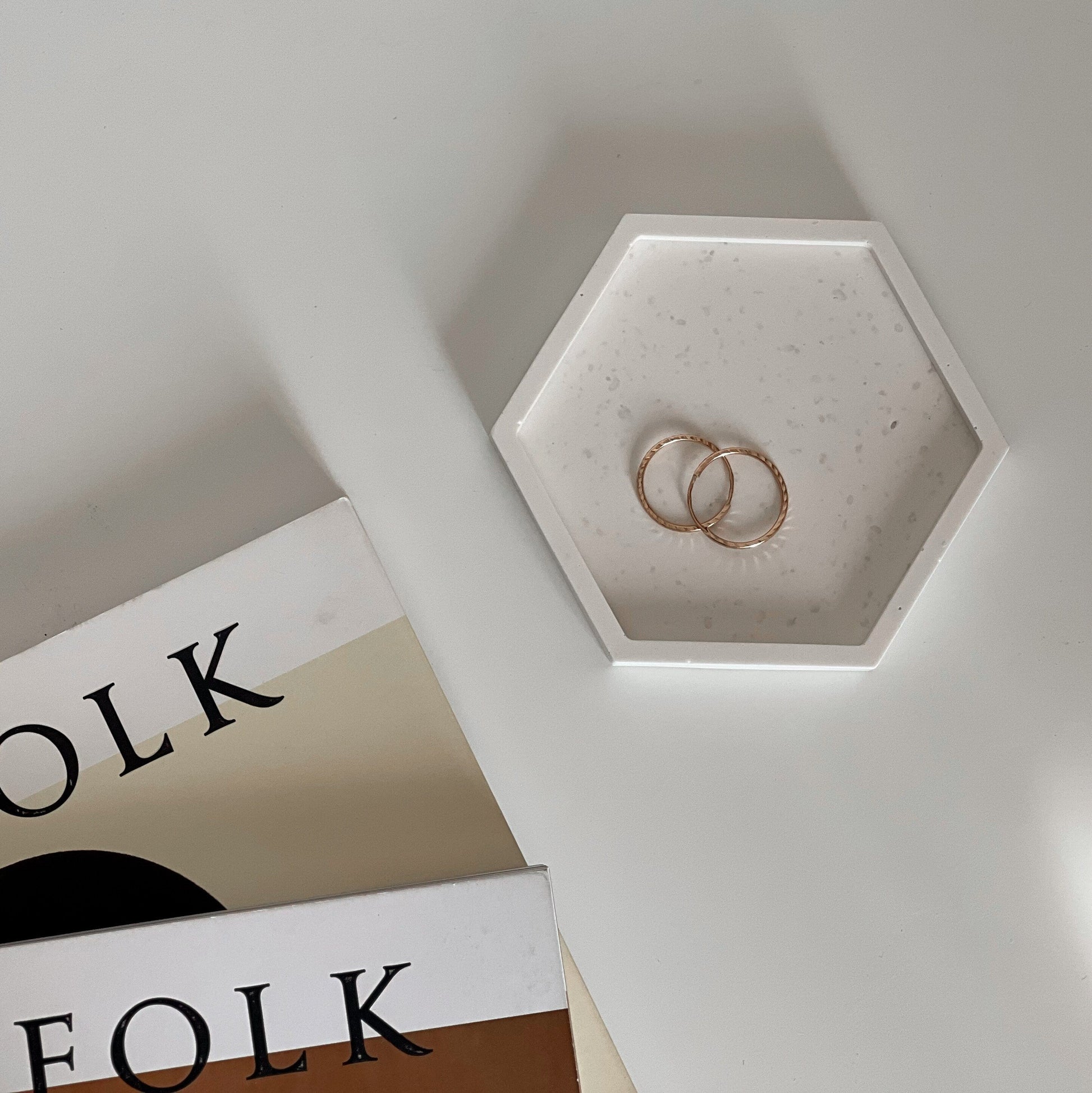 Jesmonite hexagon trinket tray styled with jewelry