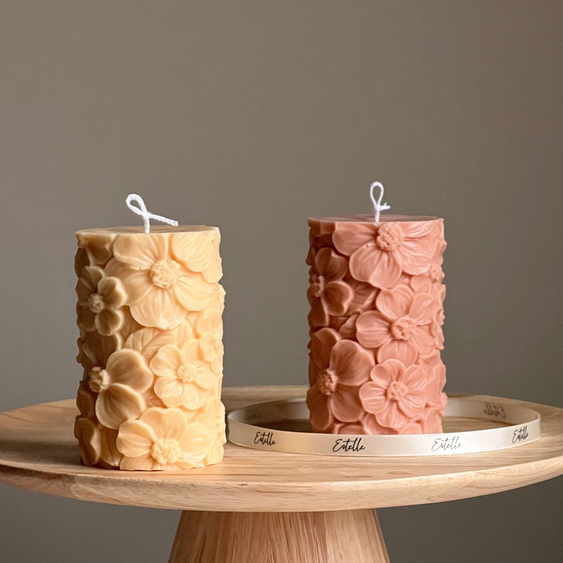 Sakura soy wax pillar candle in two colors on display