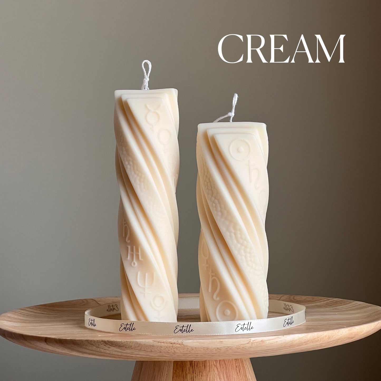 Astrological soy pillar candles in cream