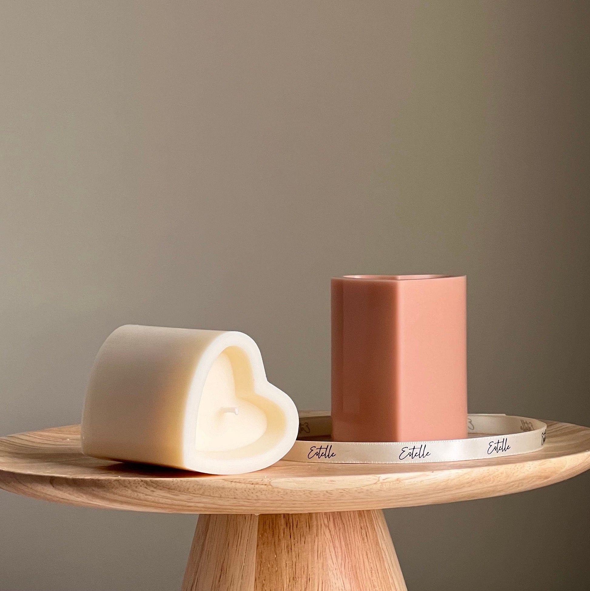 Heart soy pillar candle in two colors on display