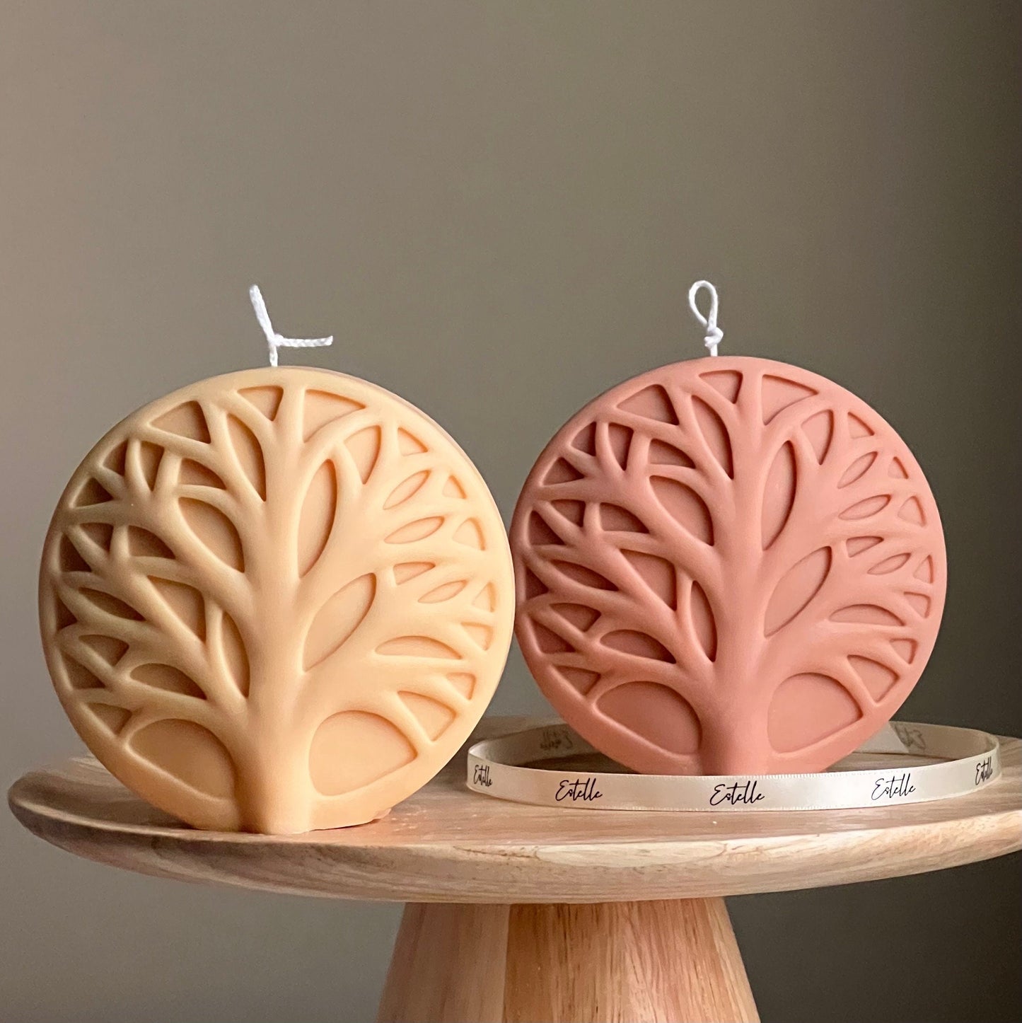 Round tree medallion soy pillar candle in two colors on display
