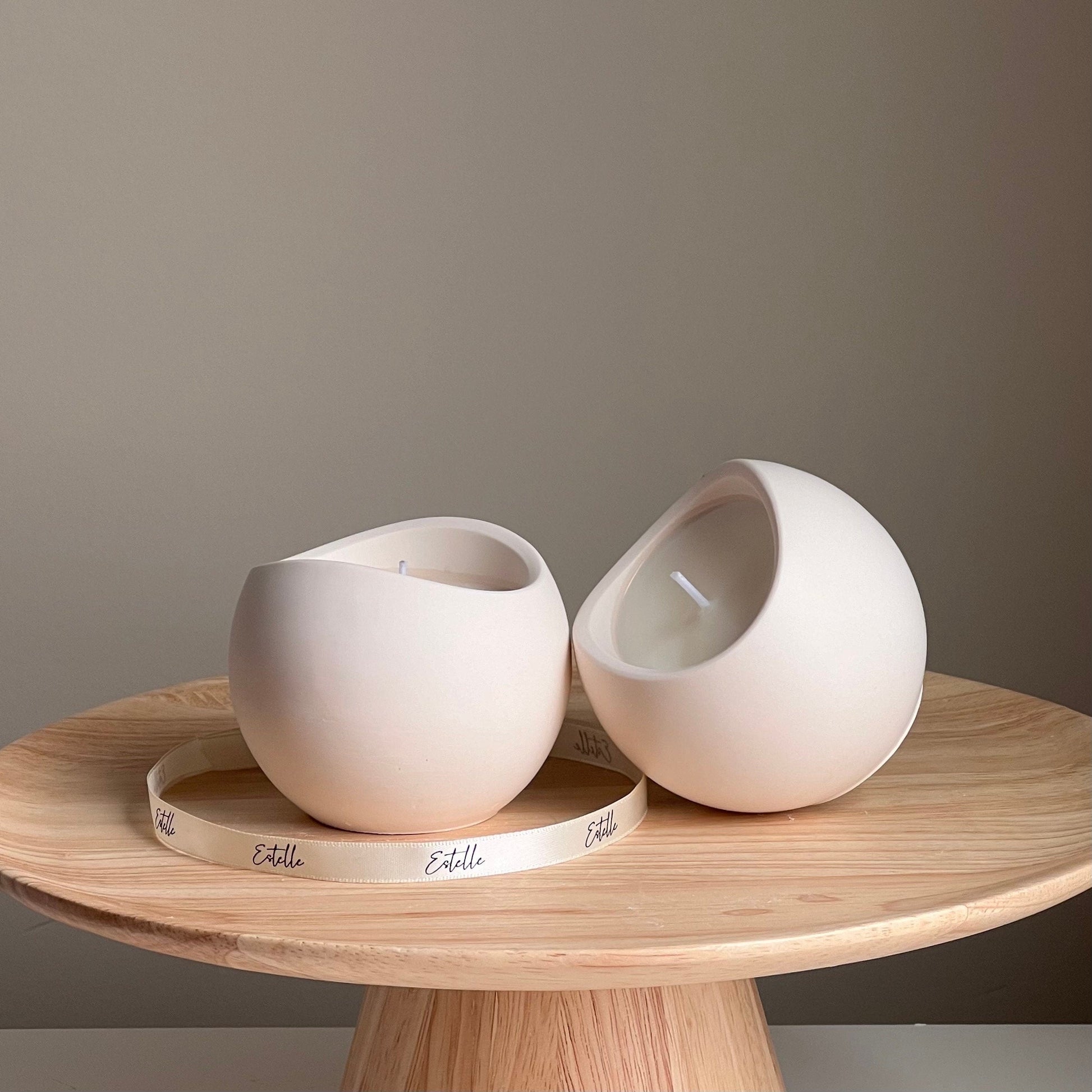 Scented soy candle in jesmonite bowl vessel side view