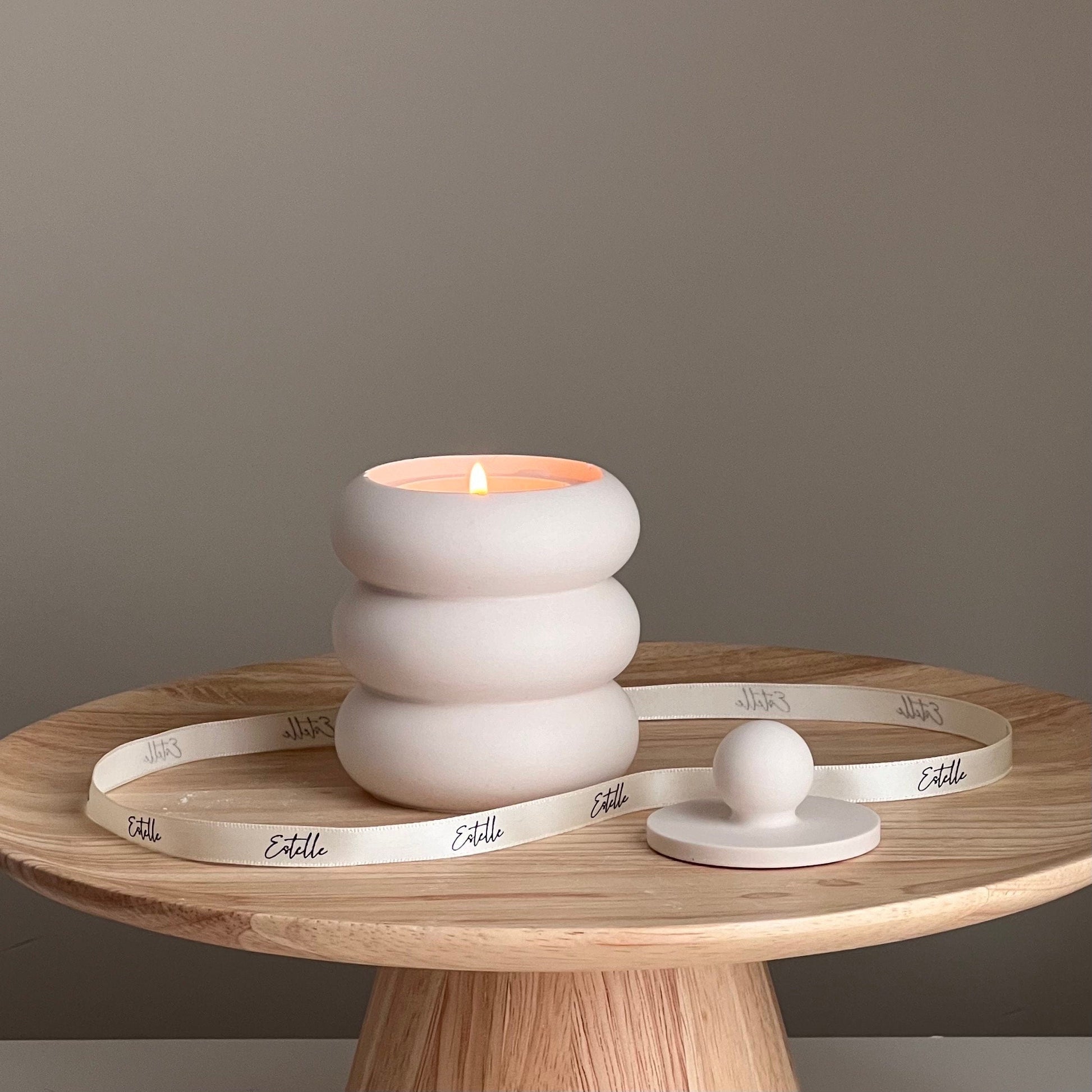 Scented soy candle in donut jar jesmonite dish side view