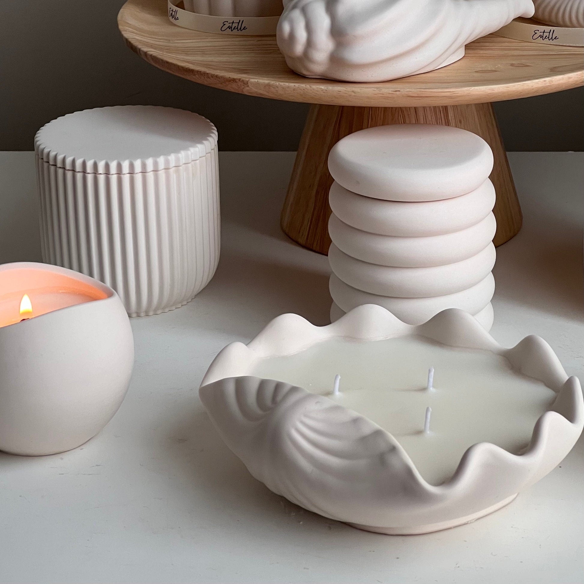 Clam shell shaped soy candle in jesmonite dish