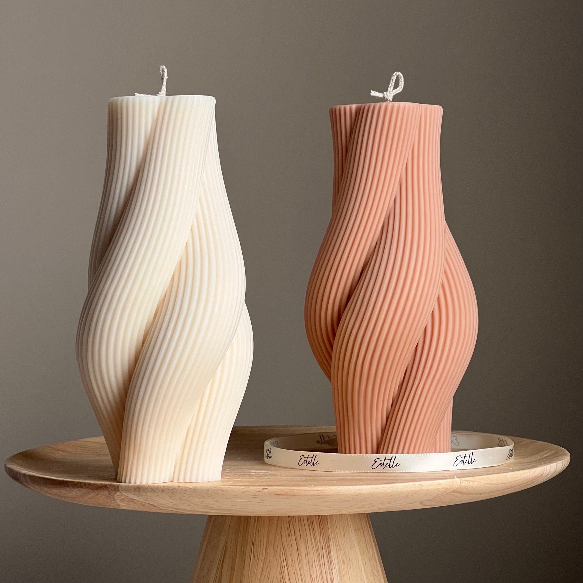 Twisted rope soy pillar candle in two colors on display