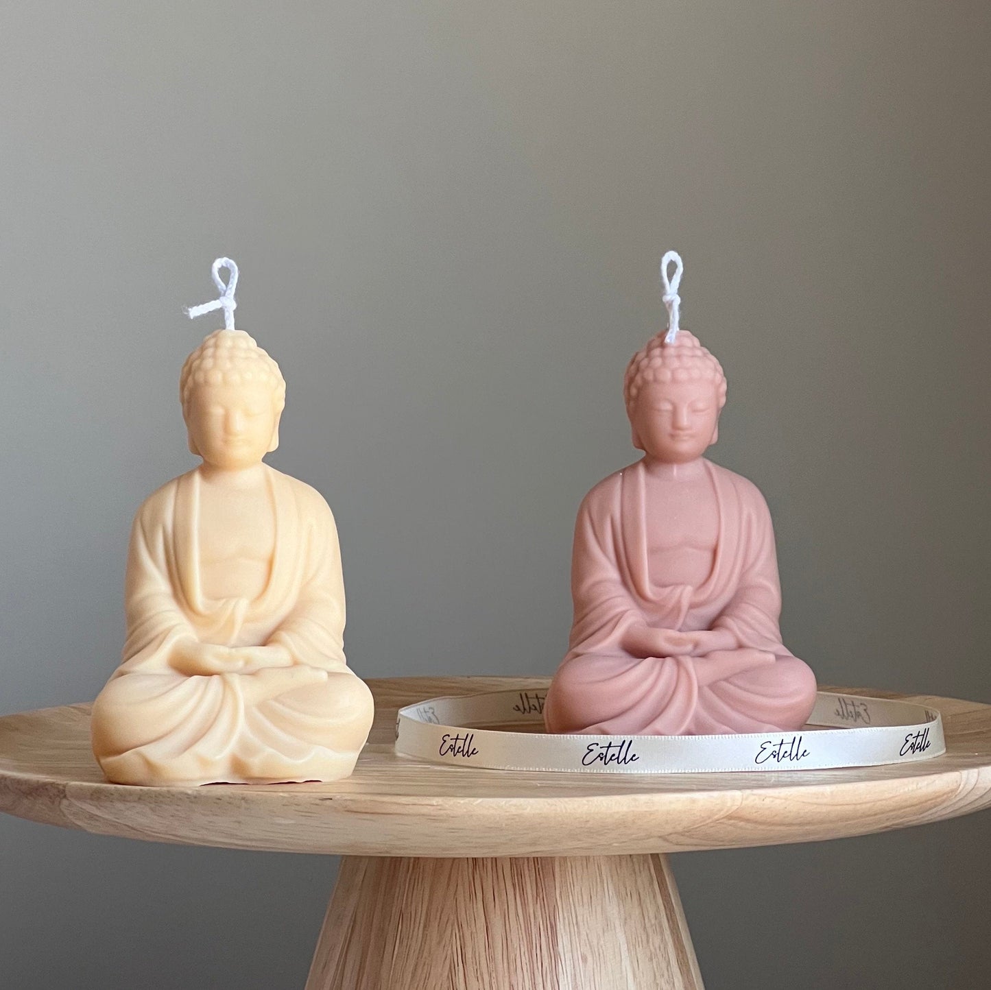 Buddha soy candle in two colors on display