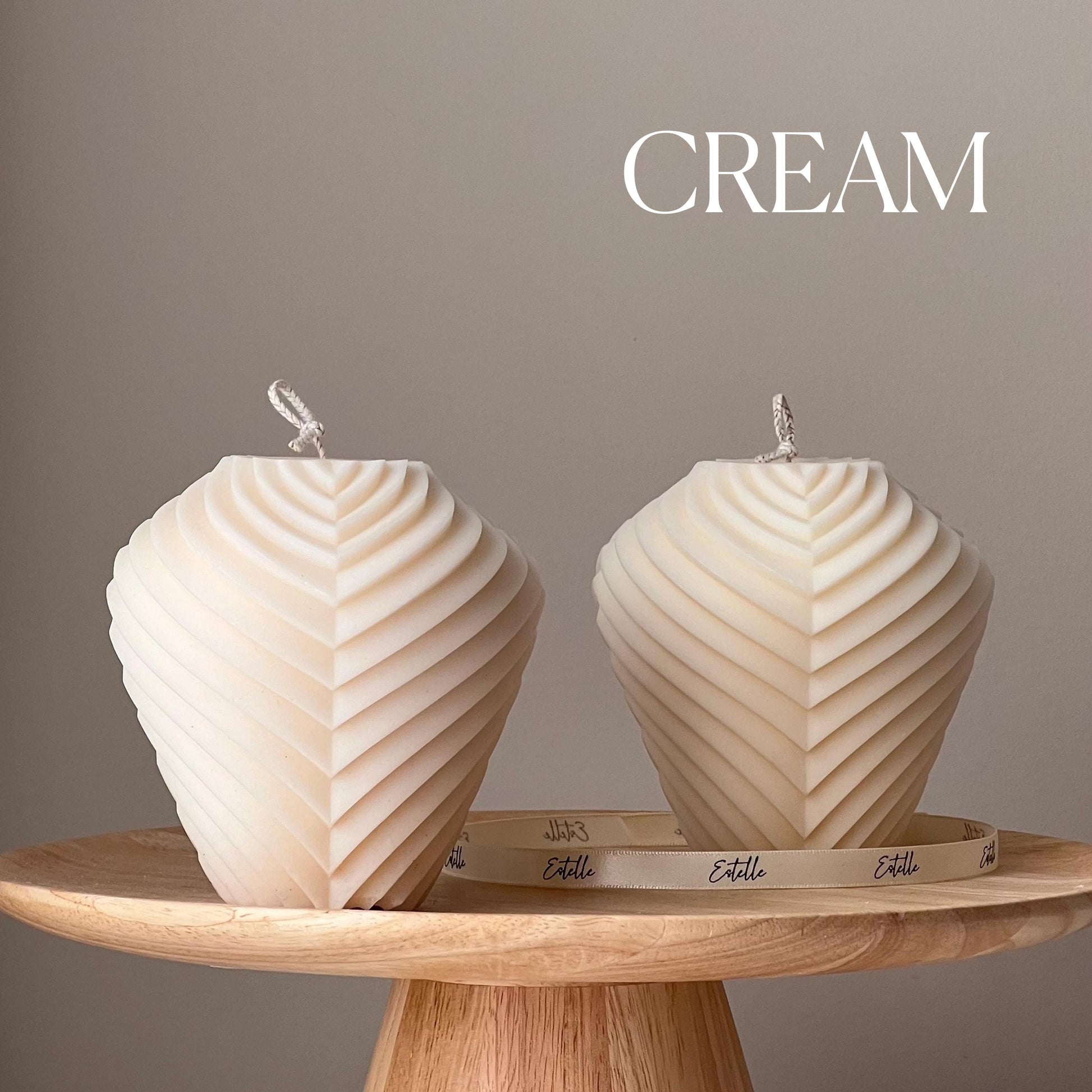 Two large ribbed soy pillar candle in cream