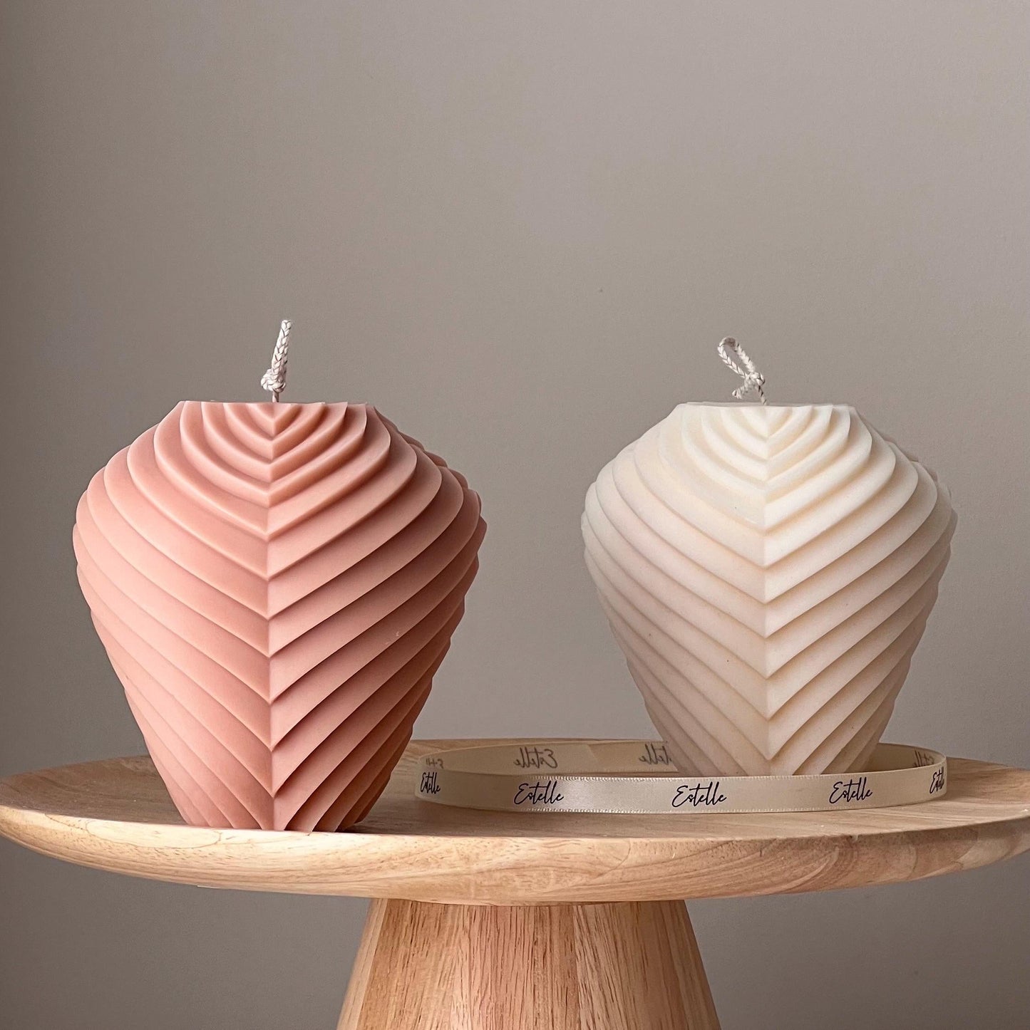 Large ribbed soy pillar candle in two colors on display