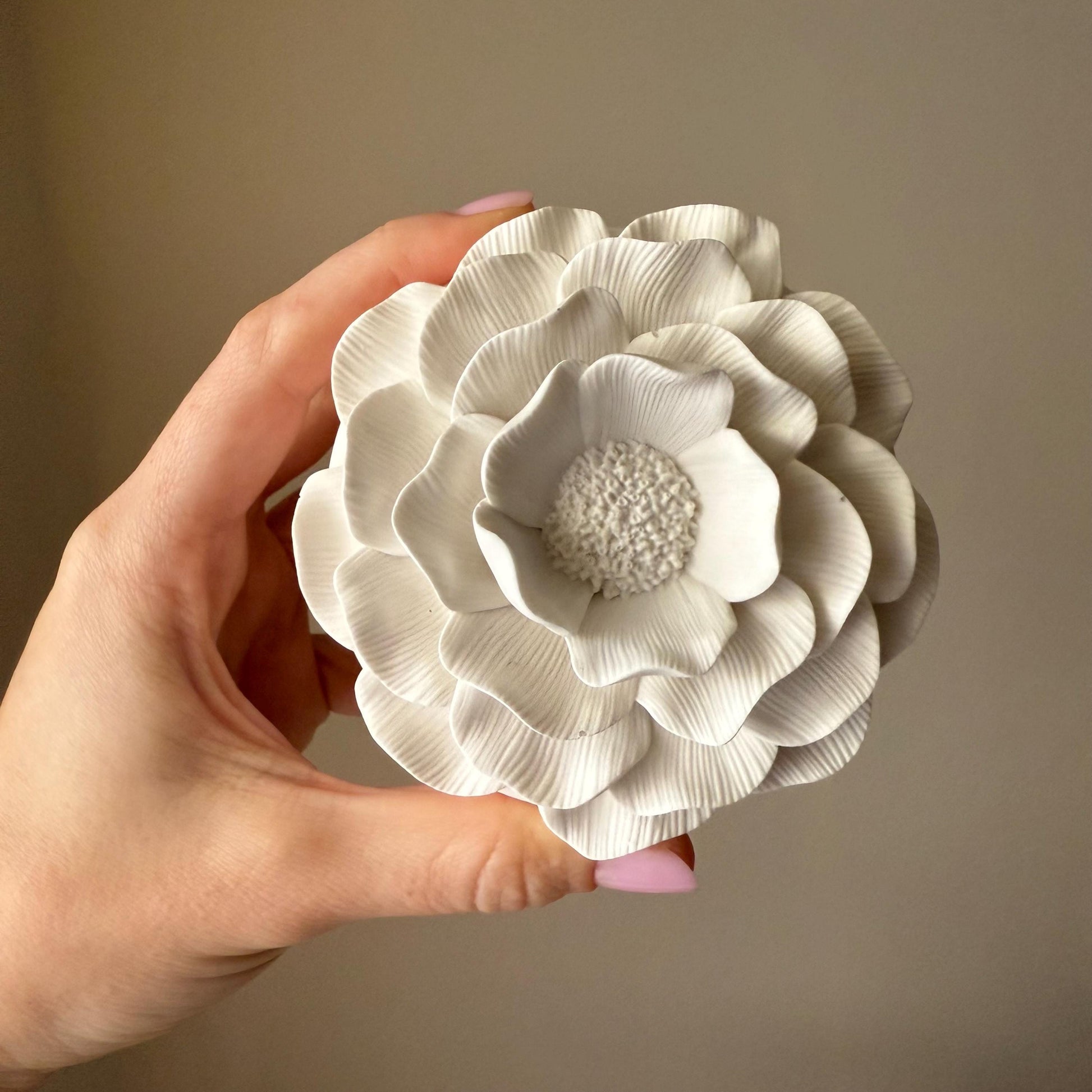 Handmade camelia soy candle jesmonite vessel top view