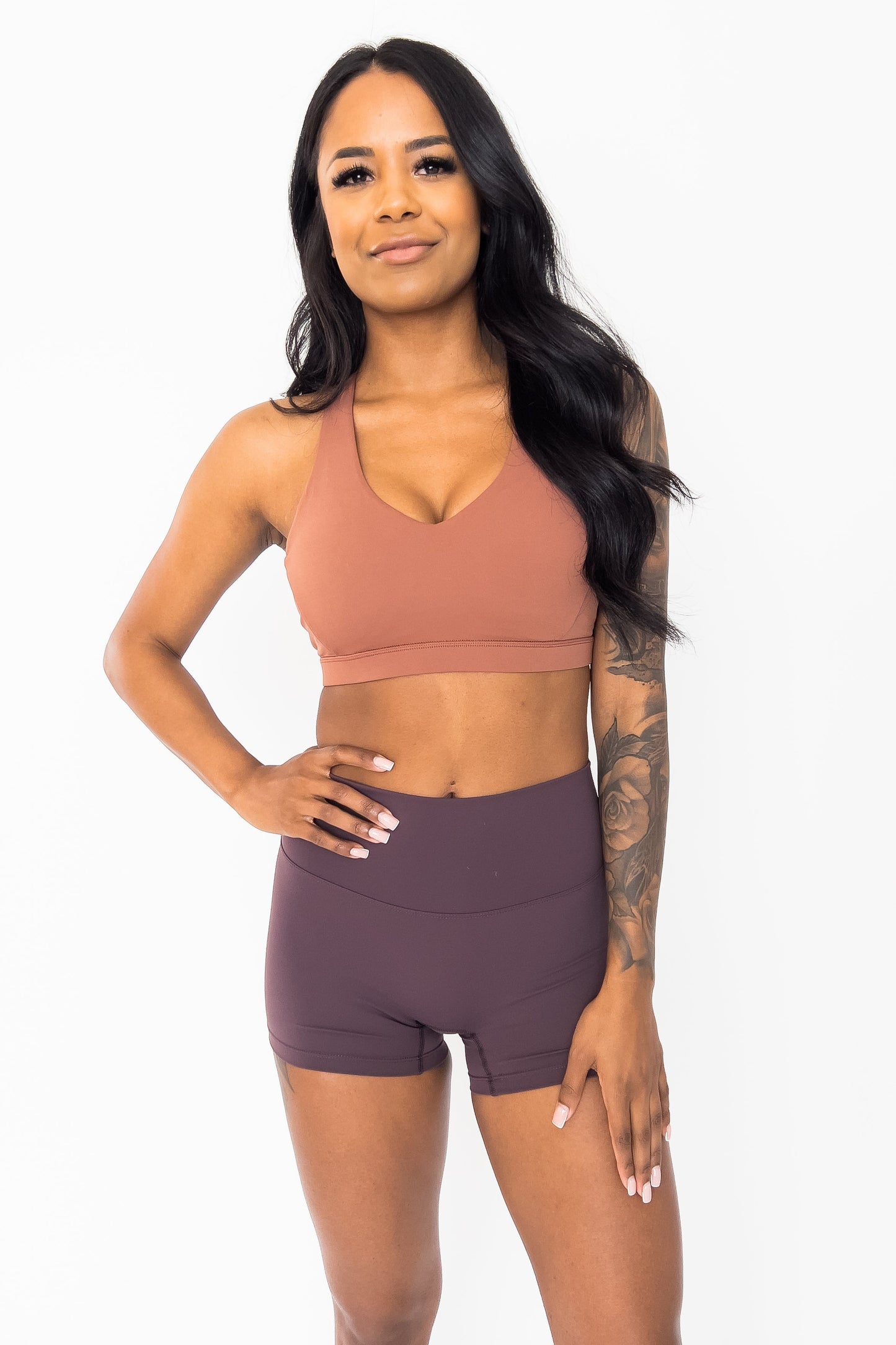 front view of woman wearing barely There 4" yoga shorts in deep chestnut, lightweight squat-proof activewear