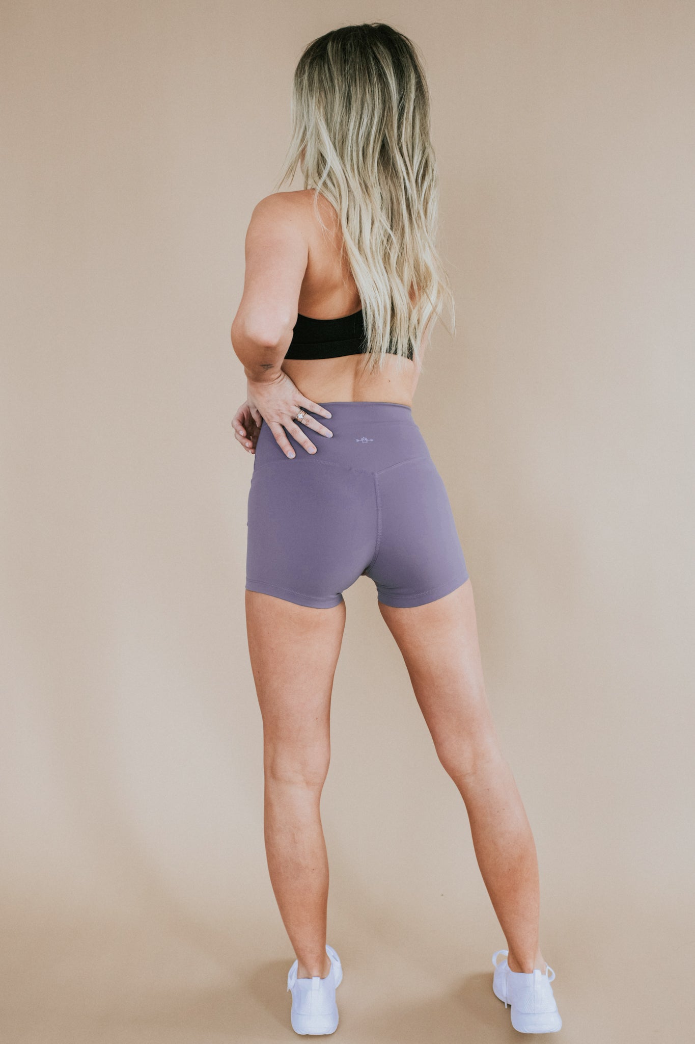 back view of woman wearing barely There 4" yoga shorts in frosted grape, lightweight squat-proof activewear