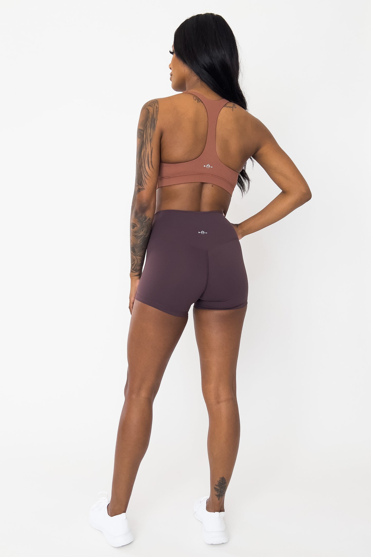 back view of woman wearing barely There 4" yoga shorts in deep chestnut, lightweight squat-proof activewear
