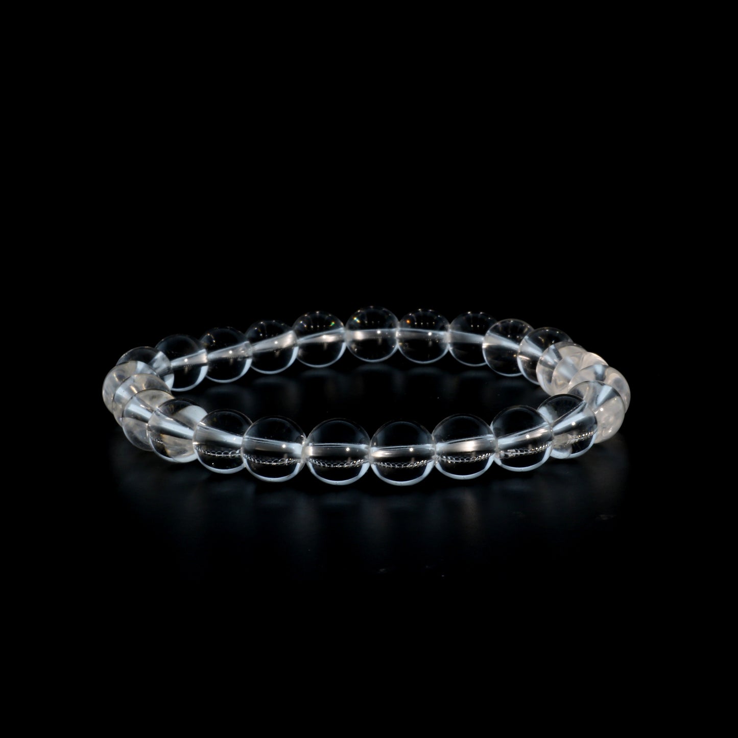 Clear quartz bracelet close-up showing natural transparent crystal beads