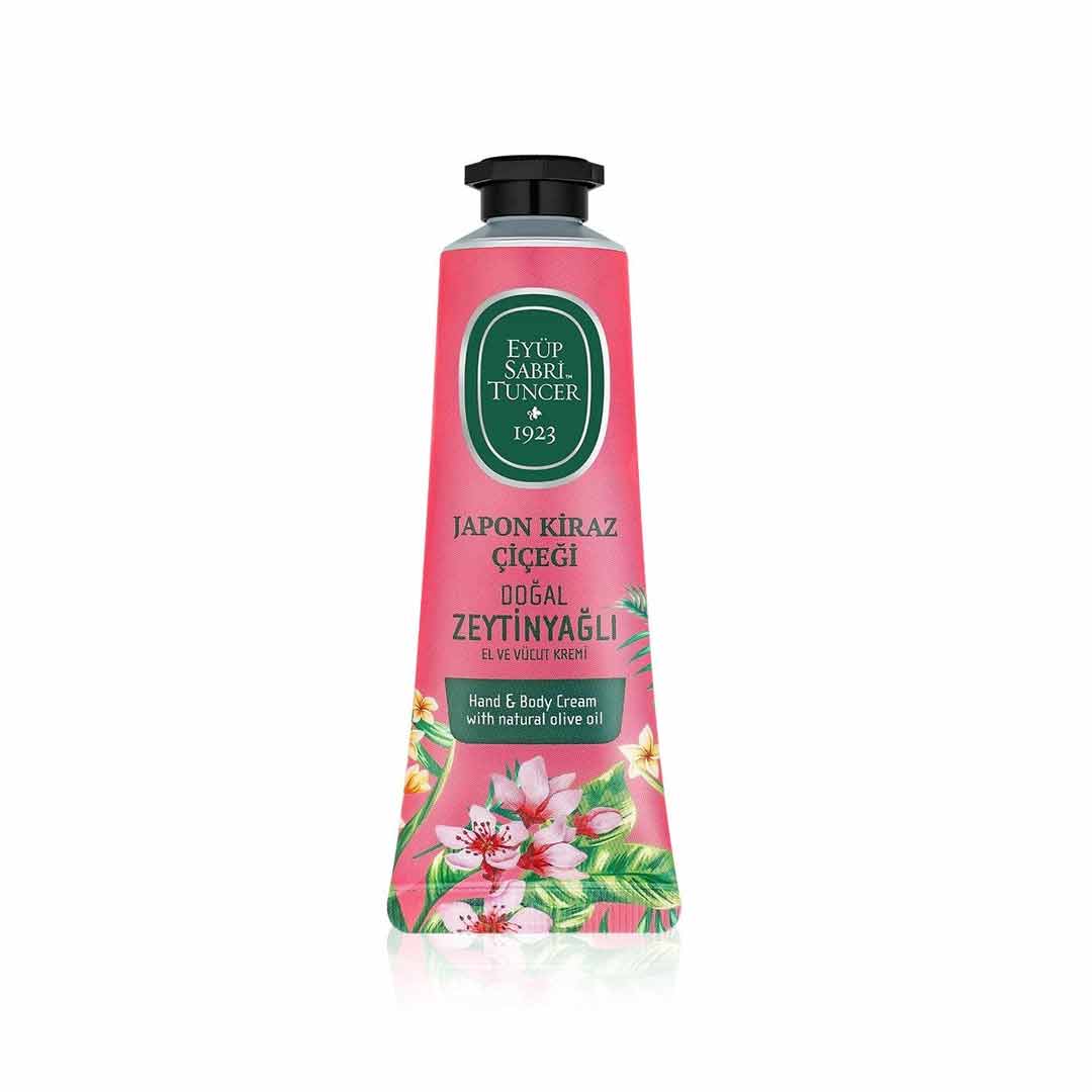 Pink bottle of Japanese Cherry Blossom Olive Oil Hand & Body Cream – 50 ml with floral design on a white background