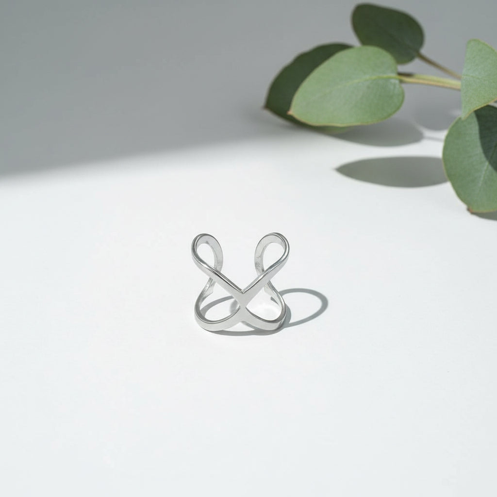 Handcrafted silver stainless steel X ring — minimalist bohemian jewelry from Bali