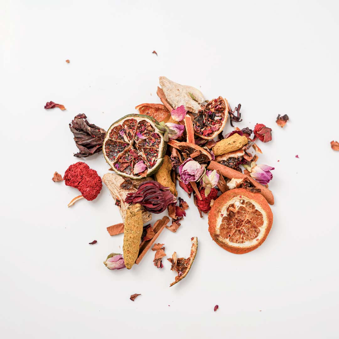 Loose leaf root tea by Rayhana Organics — dried spiced citrus herbs for natural comfort and warmth