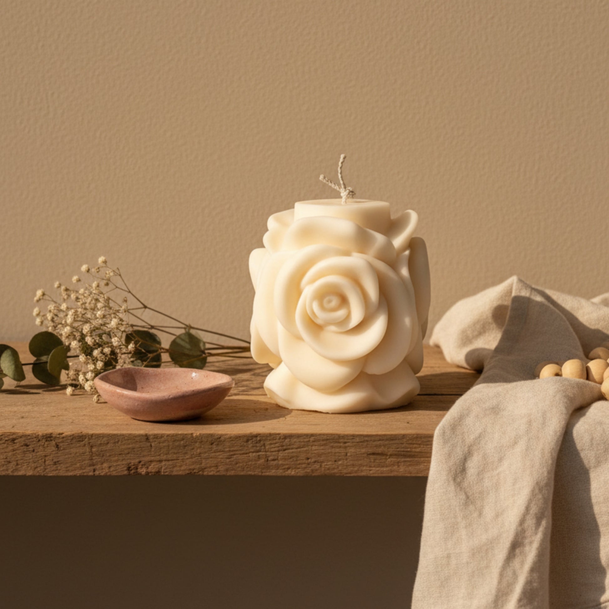 Estelle Studio rose pillar candle cream ivory styled on wooden shelf in bohemian home — sculptural floral soy candle romantic home décor Canada