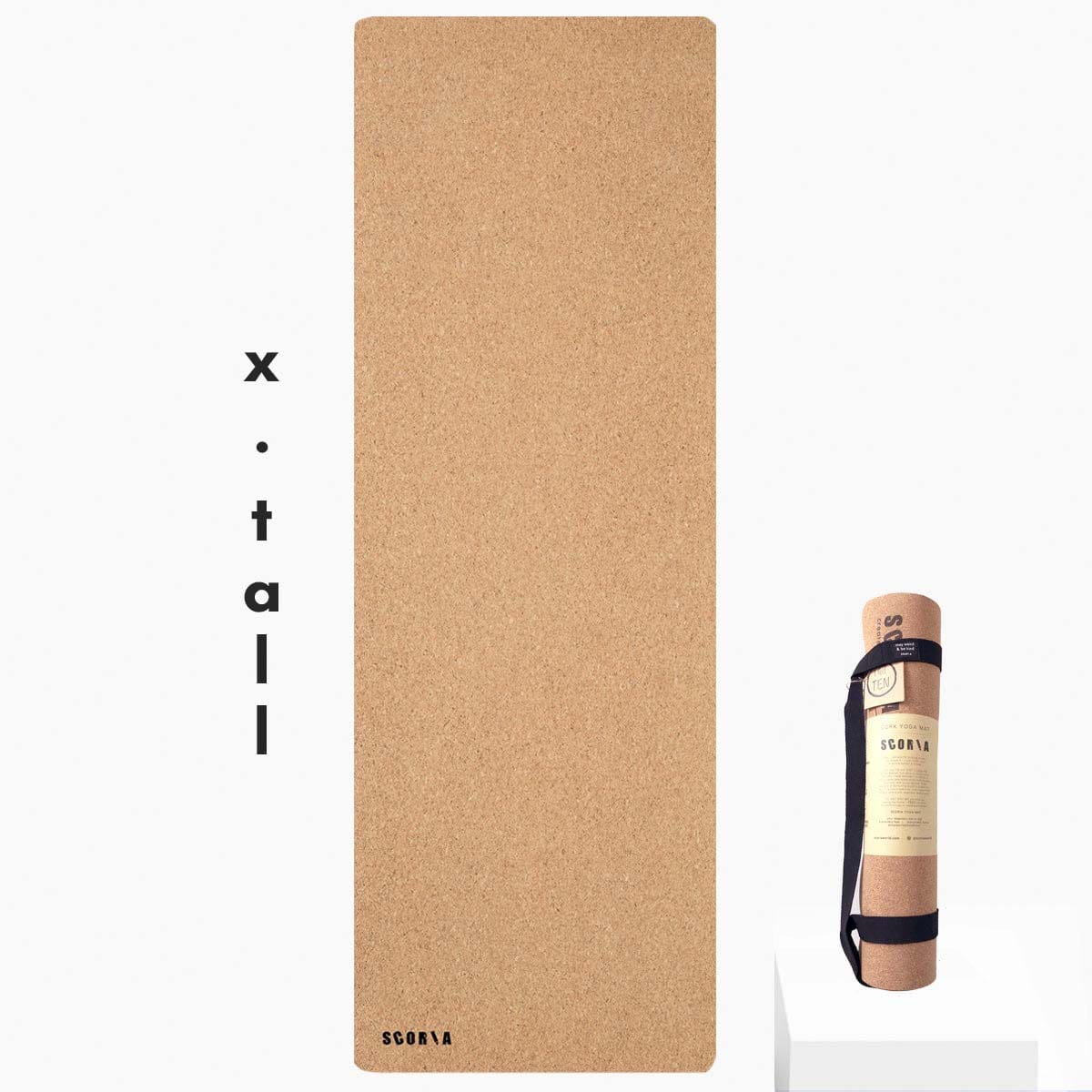 extra tall cork yoga mat with carrying strap on a white background