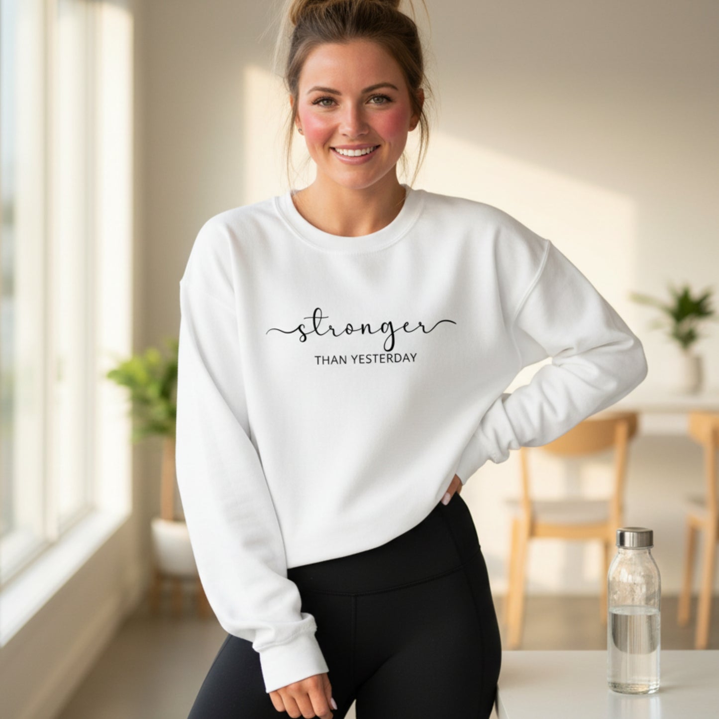 White Stronger Than Yesterday women's graphic sweatshirt — inspirational gift for her, perfect for gym lovers, comeback stories, and every woman levelling up