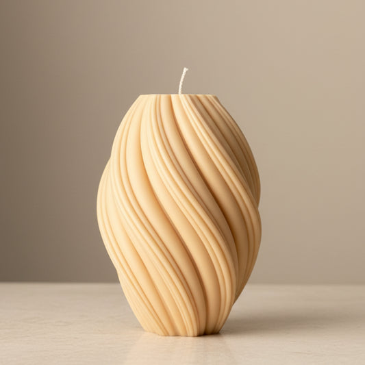 Warm sand cream oval wave ridge sculptural soy candle with diagonal flowing texture — Estelle Studio artisan statement candle, modern home décor Canada