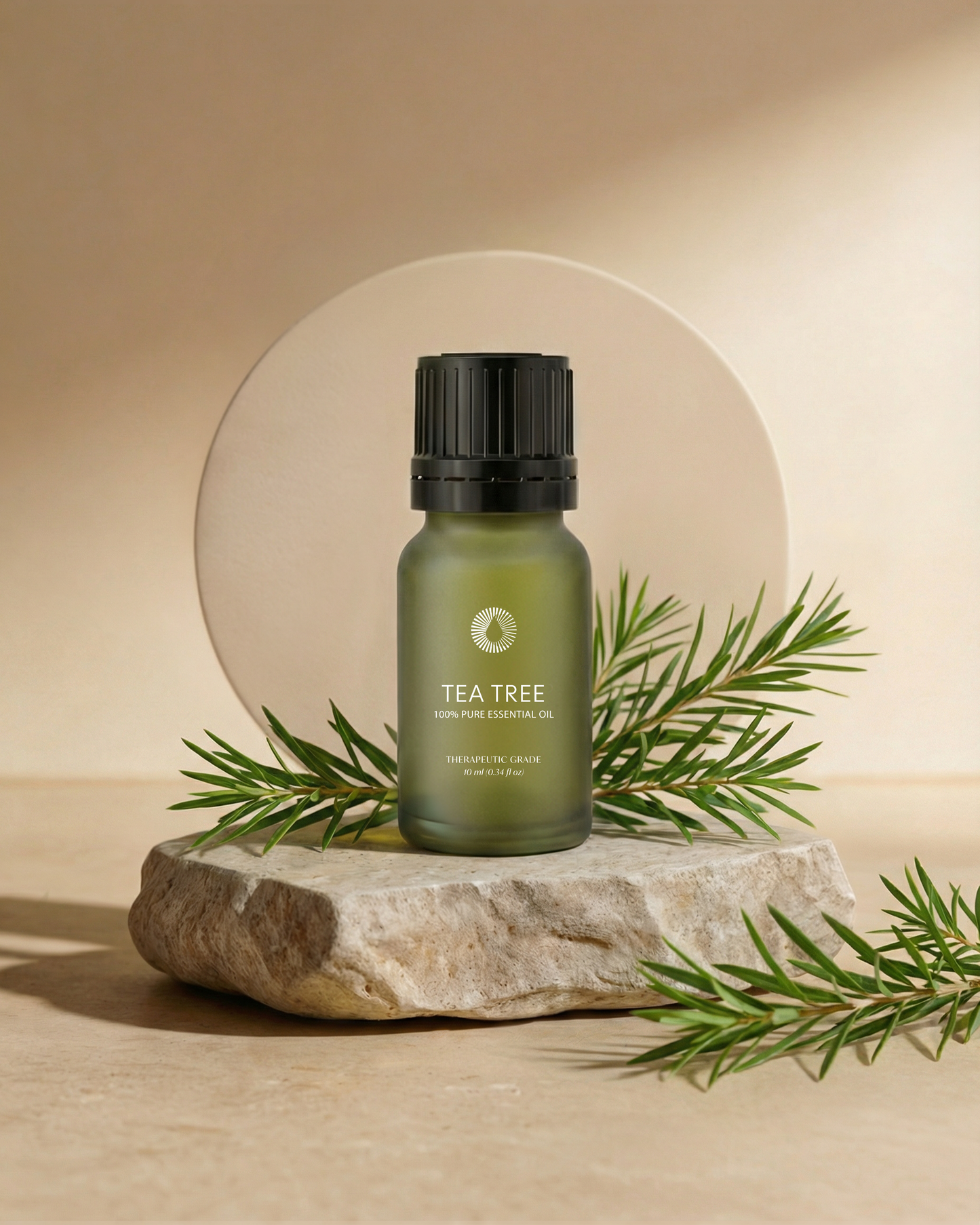 organic tea tree essential oil aromatherapy bottle on a stone surface with tea tree leaves on a beige background