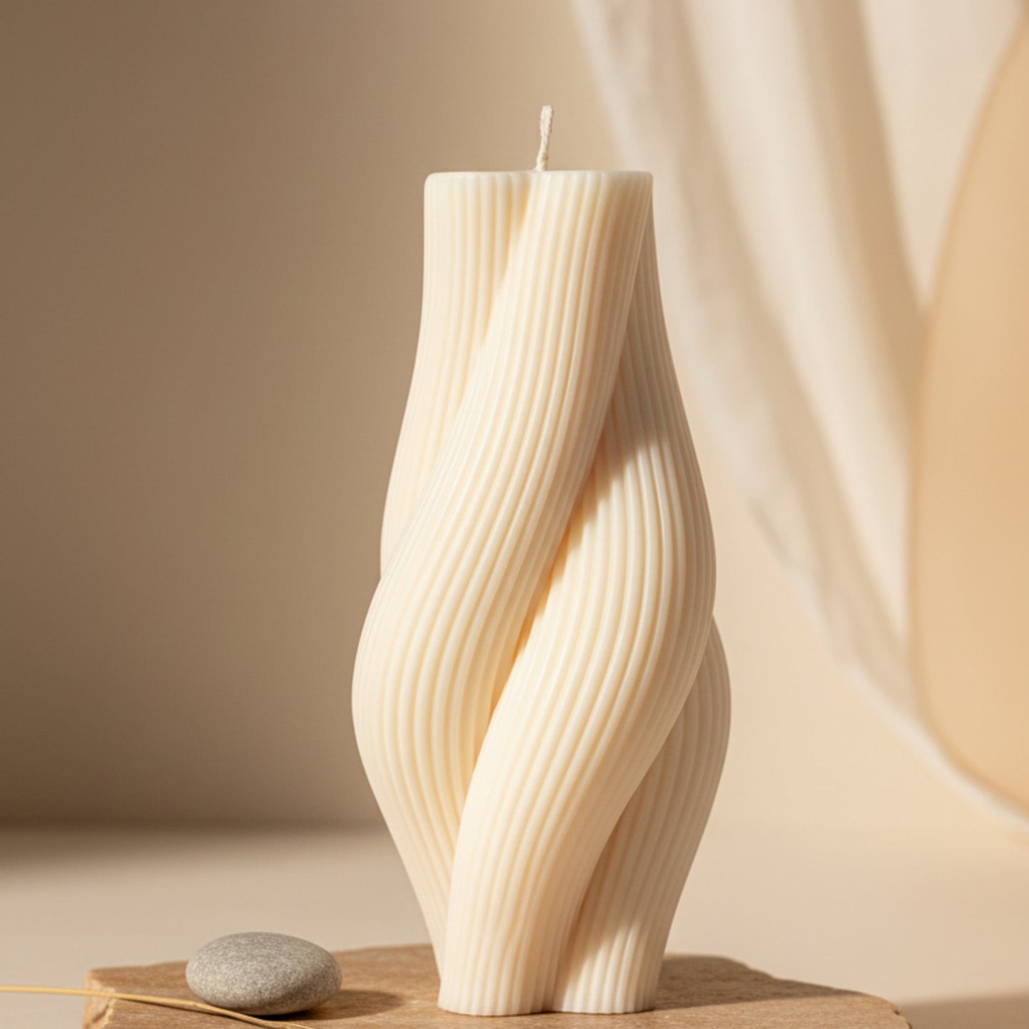twisted rope candle — cream ivory ribbed pillar candle on a natural linen surface, artisan home décor accent candle Canada