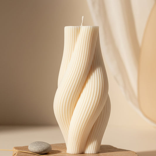 twisted rope candle — cream ivory ribbed pillar candle on a natural linen surface, artisan home décor accent candle Canada