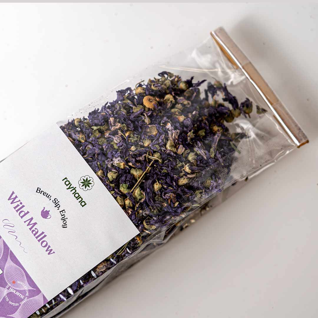 Brewing wild purple mallow flower tea — naturally violet herbal infusion for soothing wellness rituals